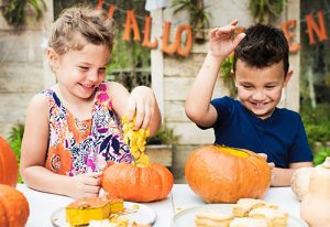 10 Fun Fall Activities for the Whole Family- Kids carving pumpkins