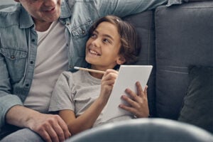 Child working on homework with parent